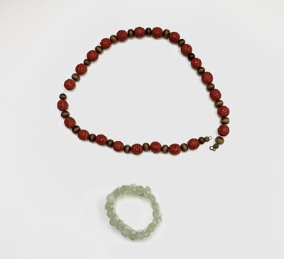 Lot 294 - A Chinese jade bracelet, diameter 7cm and a...