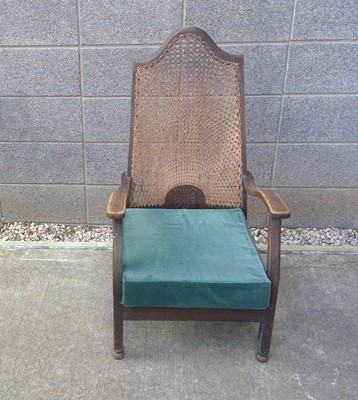 Lot 23 - An Antique Armchair with a Cane Back.