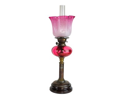 Lot 35 - A Victorian cranberry glass oil lamp.