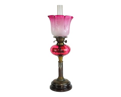 Lot 35 - A Victorian cranberry glass oil lamp.