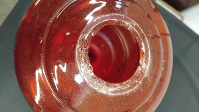 Lot 35 - A Victorian cranberry glass oil lamp.