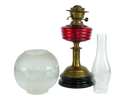 Lot 35 - A Victorian cranberry glass oil lamp.