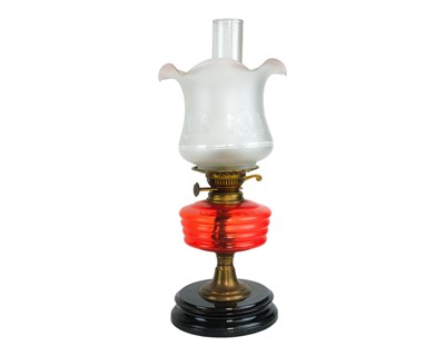 Lot 35 - A Victorian cranberry glass oil lamp.