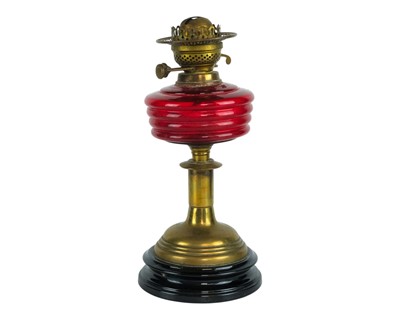 Lot 35 - A Victorian cranberry glass oil lamp.
