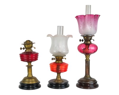 Lot 35 - A Victorian cranberry glass oil lamp.