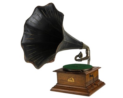 Lot 428 - An HMV oak cased table top horn gramophone.