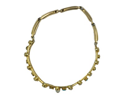 Lot 164 - A Victorian gold cabochon turquoise and pearl set openwork bracelet.