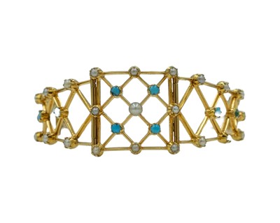 Lot 164 - A Victorian gold cabochon turquoise and pearl set openwork bracelet.