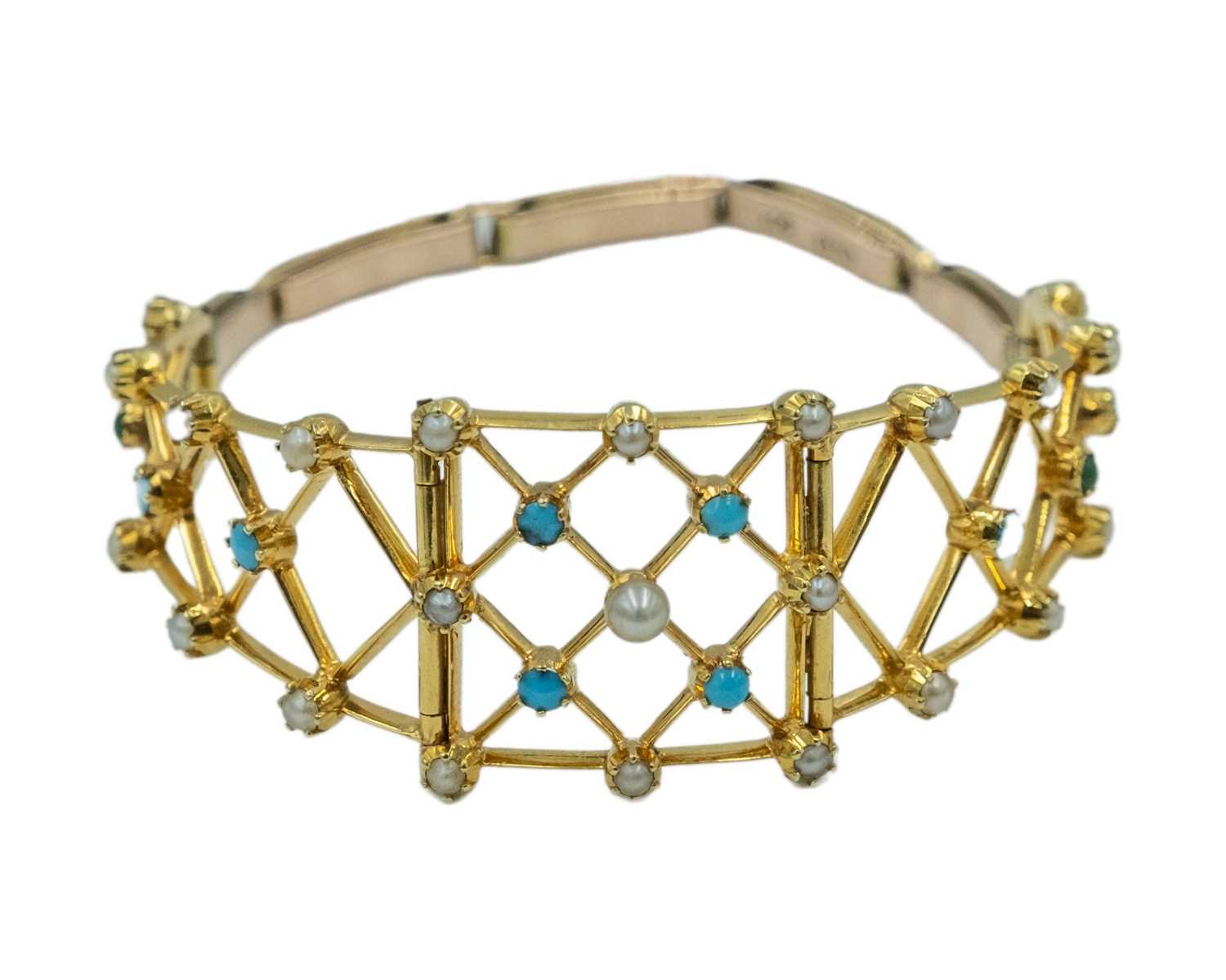 Lot 164 - A Victorian gold cabochon turquoise and pearl set openwork bracelet.