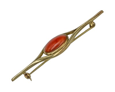 Lot 176 - An Italian 18k yellow gold red coral set bar brooch.