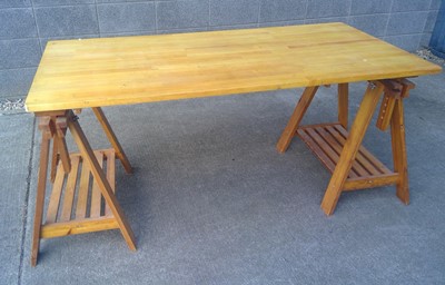 Lot 17 - An Adjustable Height Trestle Dining Table....