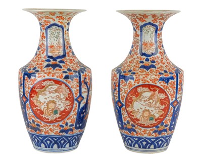 Lot 499 - A pair of Japanese Imari vases and covers.