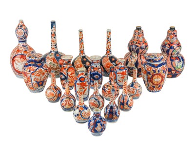 Lot 521 - A pair of Japanese Imari double gourd shape vases.