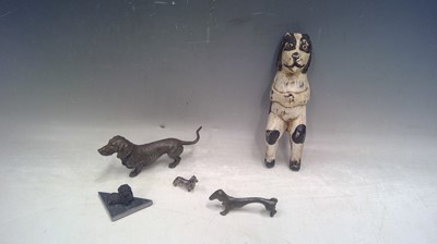 Lot 41 - Four Dachshunds and a Wooden Dog. The Largest...