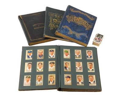 Lot 361 - Crests, Monograms and Cigarette Cards in four albums.