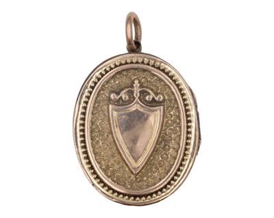 Lot 186 - A Victorian gold front and back oval locket pendant.