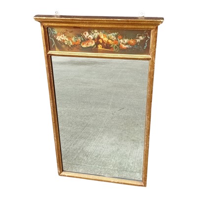 Lot 85 - A giltwood wall mirror with an upper floral...