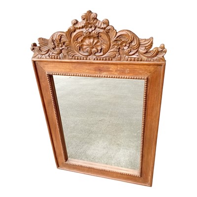 Lot 87 - A carved stained wood-frame wall mirror. 78 x...