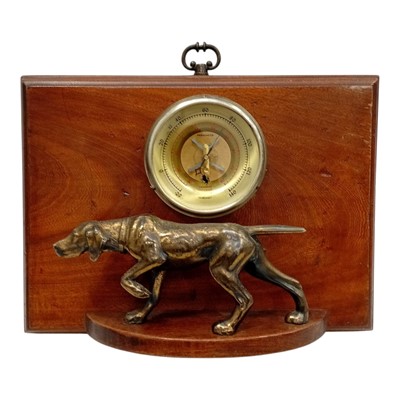 Lot 97 - A vintage wall thermometer on a polished wood...