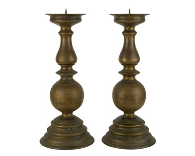 Lot 856 - A pair of substantial bronze pricket candlesticks.