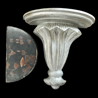 Lot 115 - A carved wooden wall sconce with a metallic...