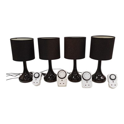 Lot 157 - Four matching table lamps, 34 cm high. With...