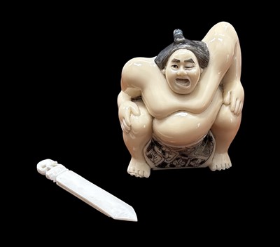 Lot 139 - A Japanese resin netsuke in the form of a sumo...