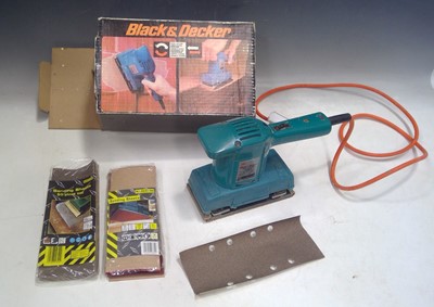 Lot 42 - A Black and Decker Sander and Sanding Sheets....