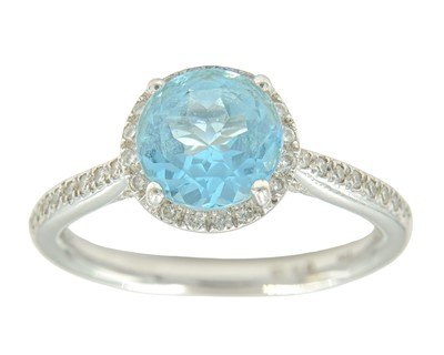 Lot 87 - A blue topaz and diamond halo ring, set in 18k white gold.