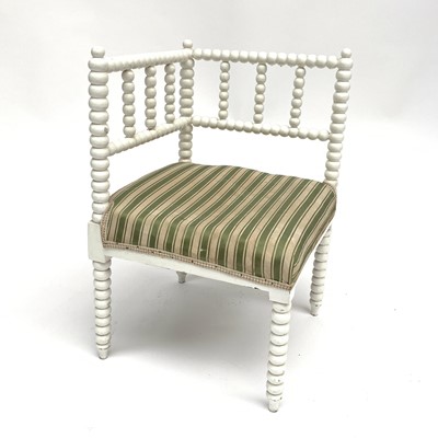 Lot 3245 - A white bobbin corner chair with upholstered...