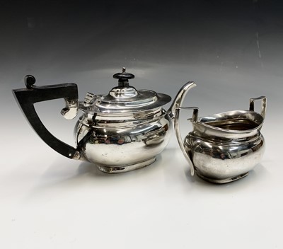 Lot 83 - A silver small oval section teapot and similar...