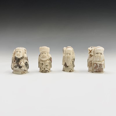 Lot 295 - Four Japanese bone incised netsukes, each...