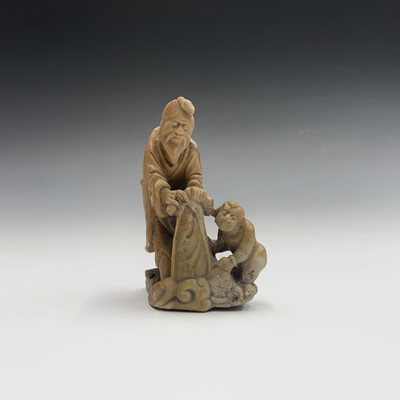 Lot 275 - A Chinese carved soapstone group, early 20th...