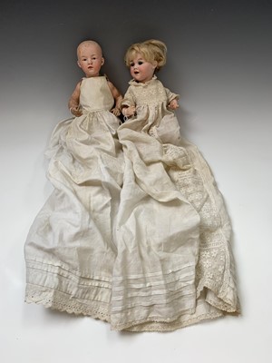 Lot 600 - Two German bisque dolls. The baby doll with...
