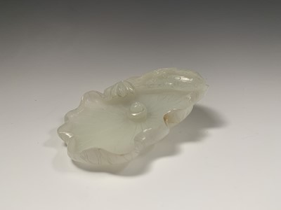 Lot 11 - A Chinese white jade 'lotus leaf' brushwasher,...