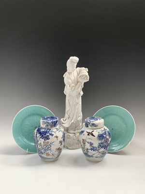 Lot 146 - A near pair of Chinese celadon porcelain...