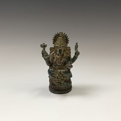 Lot 373 - A small Indian bronze figure of Ganesha,...