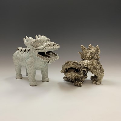 Lot 159 - A Chinese celadon glazed pottery dog of fo,...