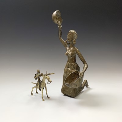 Lot 158 - A heavy Benin bronze figure of a kneeling lady,...
