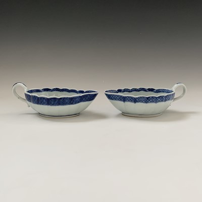 Lot 162 - A near pair of Chinese export blue and white...
