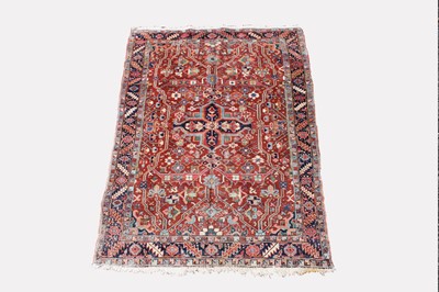 Lot 439 - A Heriz rug, North West Persia, the madder...