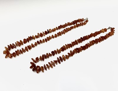 Lot 634 - Two amber necklaces 64gm