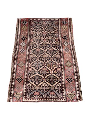 Lot 456 - A Kurdish rug, the charcoal compartment field...