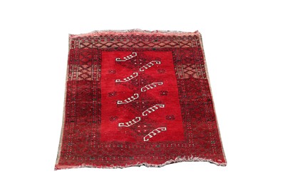 Lot 457 - An Afghan rug, the madder field with four...