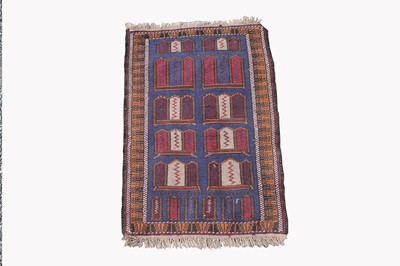 Lot 461 - An Afghan Belouch rug, the indigo field with...