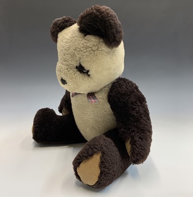 Lot 591 - A 20th century plush panda with jointed limbs....