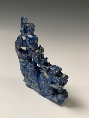 Lot 110 - A Chinese lapis lazuli carving of a boy on a...