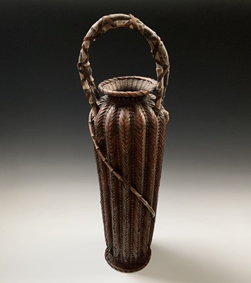 Lot 73 - A Japanese bamboo and wicker fish basket, with...
