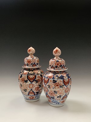 Lot 97 - A pair of Japanese imari vases and covers,...
