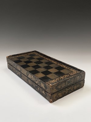 Lot 64 - A Chinese export black lacquered folding games...